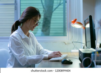 Young Woman Working On Co-working Home At Night.