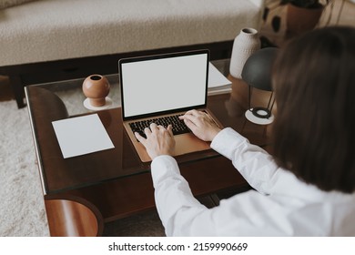 Young Woman Working On Laptop Computer With Copy Space. Comfortable Home Office Workspace Interior Design. Work At Home