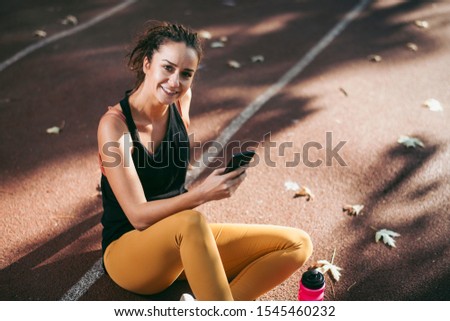 Similar – Attractive sporty woman with her cell phone