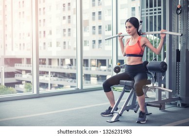 Young woman working out in fitness. Sport and healthy concept. - Shutterstock ID 1326231983