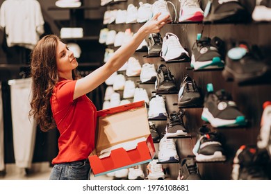 Young woman working at sportswear shop