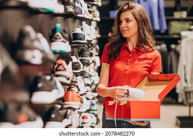 Young Woman Working At Sportswear Shop