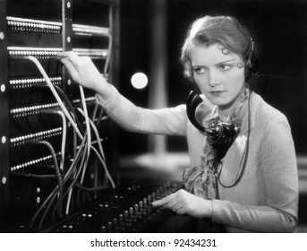 Young woman working as a telephone operator