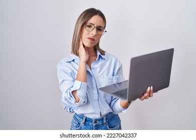 Young Woman Working Using Computer Laptop Touching Mouth With Hand With Painful Expression Because Of Toothache Or Dental Illness On Teeth. Dentist Concept. 