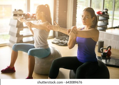 Young woman workout in healthy club. Young woman on Pilates ball.  - Powered by Shutterstock