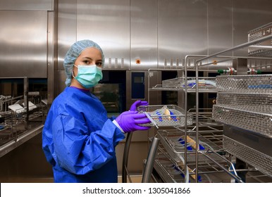 A young woman works in a hospital as a 
medical hygiene technician. She is dressed 
in special medical hygiene clothing and 
carries out hygiene disinfecting and logistic
tasks.