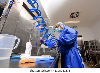 A young woman works in a hospital as a 
medical hygiene technician. She is dressed 
in special medical hygiene clothing and 
carries out hygiene disinfecting and logistic
tasks.