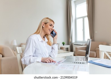 A Young Woman Works Remotely On A Laptop In Her Apartment. A Lady Talking On The Phone, Business Briefing At Home.