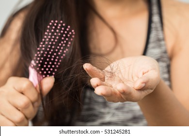 young woman worried about hair loss