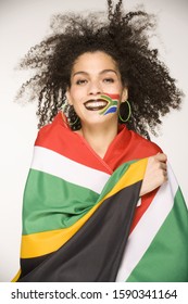 Young Woman Wrapped In South African Flag