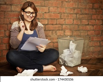 Young Woman Writer Working In The Loft