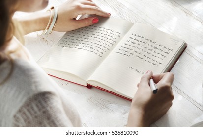 Young Woman Writing Diary Concept