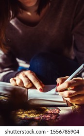 Young Woman Writing To Do List Of Goals.
Female Student Dreaming