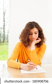 Young Woman Writing A Letter