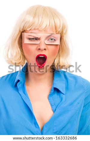 Young woman yawning. Studio shot isolated on white.