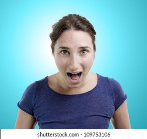 Young Woman Yelling Over Light Blue Gradient Background