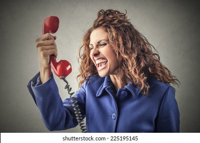 Young woman yelling at the phone