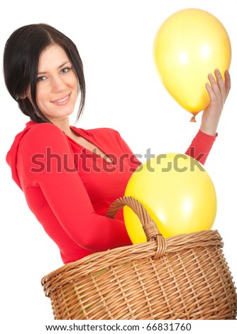 young woman with yellow balloons in wicker basket