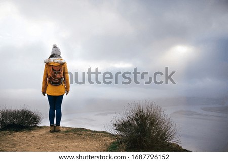 Similar – Image, Stock Photo Enjoy the view. Woman with headband, jacket. Ireland