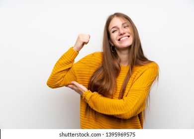 Young woman with yellow over isolated white wall making strong gesture