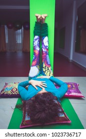 Young Woman In Yoga Relaxing Pose With Legs Up The Wall  Indoor