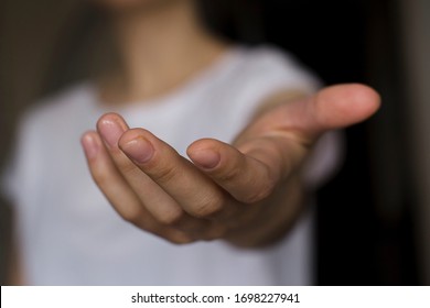 Young Woman's Hand Reaching Out