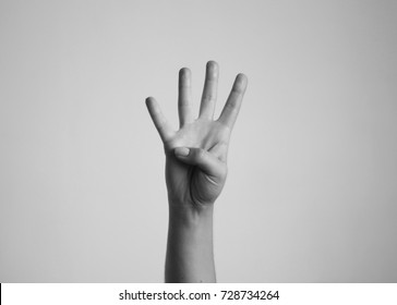 Young Woman's Hand Shows Four Fingers. Gesture.