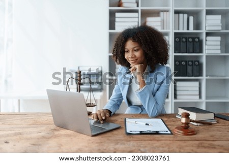 A young women African American lawyer lawsuit studying cases for clients in a law firm to fight against their parties in the courts. law and attorney concepts