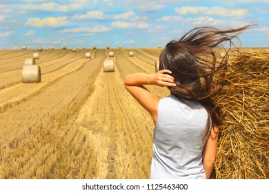 Young women and agriculture bale. - Powered by Shutterstock