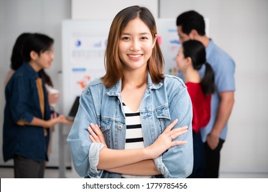 Young Women Asian Confidence Team Leader Business Looking Camera And Smile In Modern Office Room With Blurred Background Group People