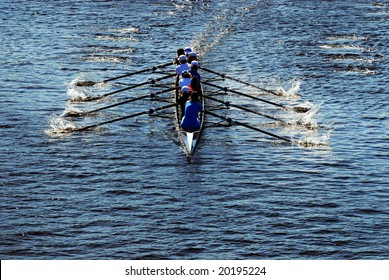 Young Women Athletes Rowing Boat