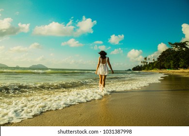 Young Women From The Back Walking In The Waterfront In El Nido, Lio Beach, Palawan Province, Philippines