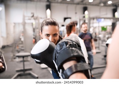 Young women boxing in gym - Powered by Shutterstock