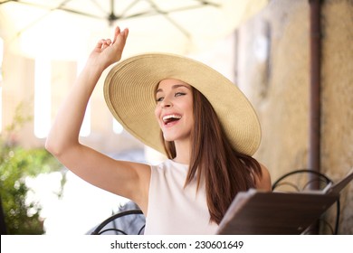 Young women calling the waitress - Powered by Shutterstock