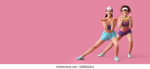 Young women doing aerobics on pink background with space for text - Powered by Shutterstock