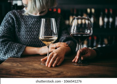 Young Women Enjoying Their Wine In A Bar