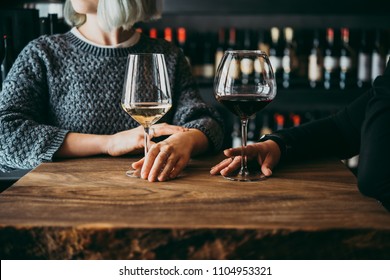 Young Women Enjoying Their Wine In A Bar