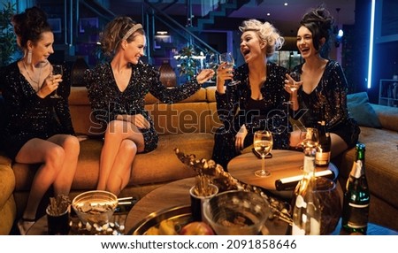 Young women having a party at home or club