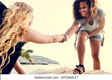 Young Women Helping Each Other