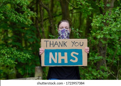 Young Women Holding NHS Thank-you Sign.