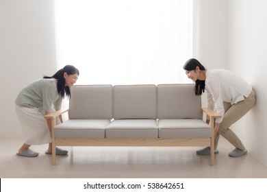 Young Women Moving In New House