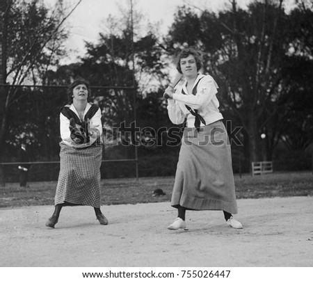 Young women playing baseball in middy shirts and long skirts in 1919. Washington, D.C.