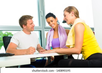 Young Women Signing Up For Gym Membership