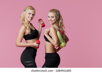 Young Women Sportswoman With Dumbbells And Fresh Vegetables In A String Bag. Healthy Eating And Dieting Concept.