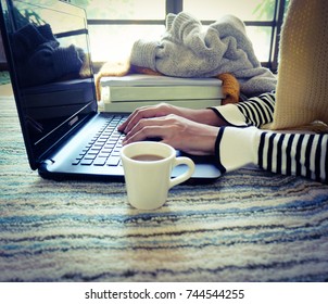 Young Women Students Using Laptop Computer With Hot Coffee At Home, Winter Morning.