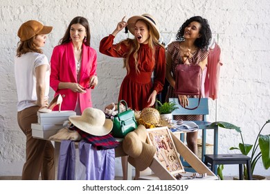 Young women at swap home party - clothes, shoes, bags, jewellery exchange between friends. Zero waste shopping, eco friendly concept, sustainable lifestyle. College life.  - Shutterstock ID 2141185019