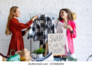 Young women at swap home party - clothes, shoes, bags, jewellery exchange between friends. Zero waste shopping, eco friendly concept, sustainable lifestyle. College life.  - Shutterstock ID 2170681041