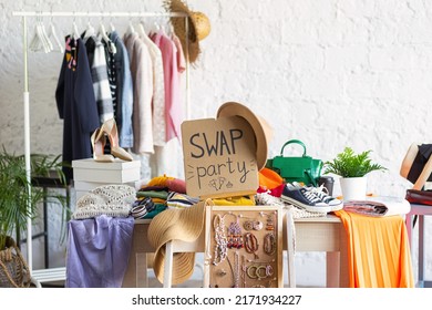 Young women at swap home party - clothes, shoes, bags, jewellery exchange between friends. Zero waste shopping, eco friendly concept, sustainable lifestyle. College life.  - Shutterstock ID 2171934227