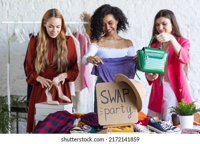 Young women at swap home party - clothes, shoes, bags, jewellery exchange between friends. Zero waste shopping, eco friendly concept, sustainable lifestyle. College life.  - Shutterstock ID 2172141859