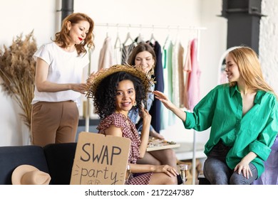 Young women at swap home party - clothes, shoes, bags, jewellery exchange between friends. Zero waste shopping, eco friendly concept, sustainable lifestyle. College life.  - Shutterstock ID 2172247387